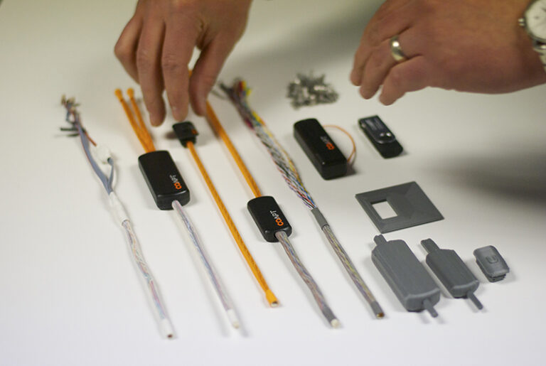 Customized housings for control systems in highly-customized prosthetics